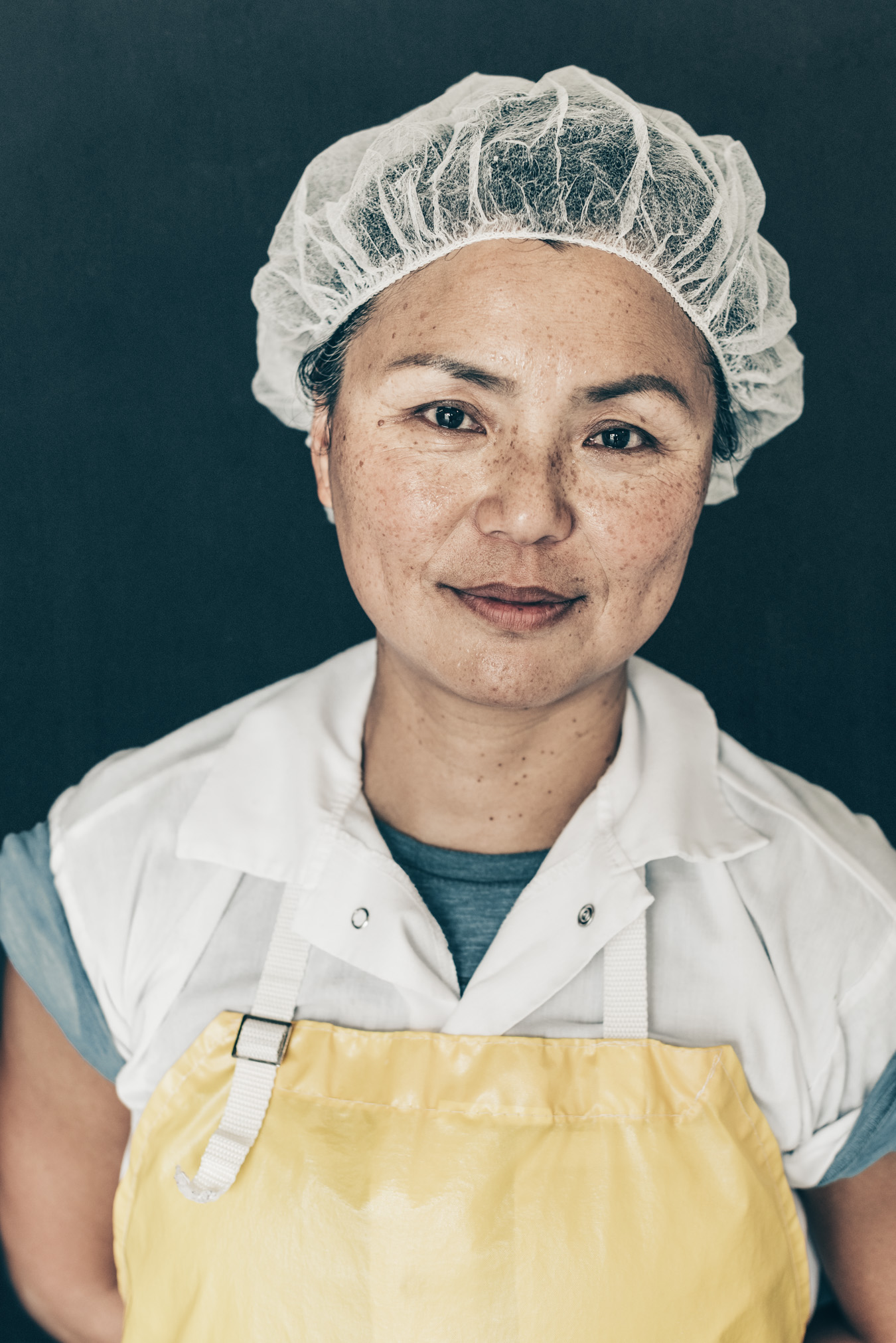 Haystack dairy goat cheese maker woman portrait